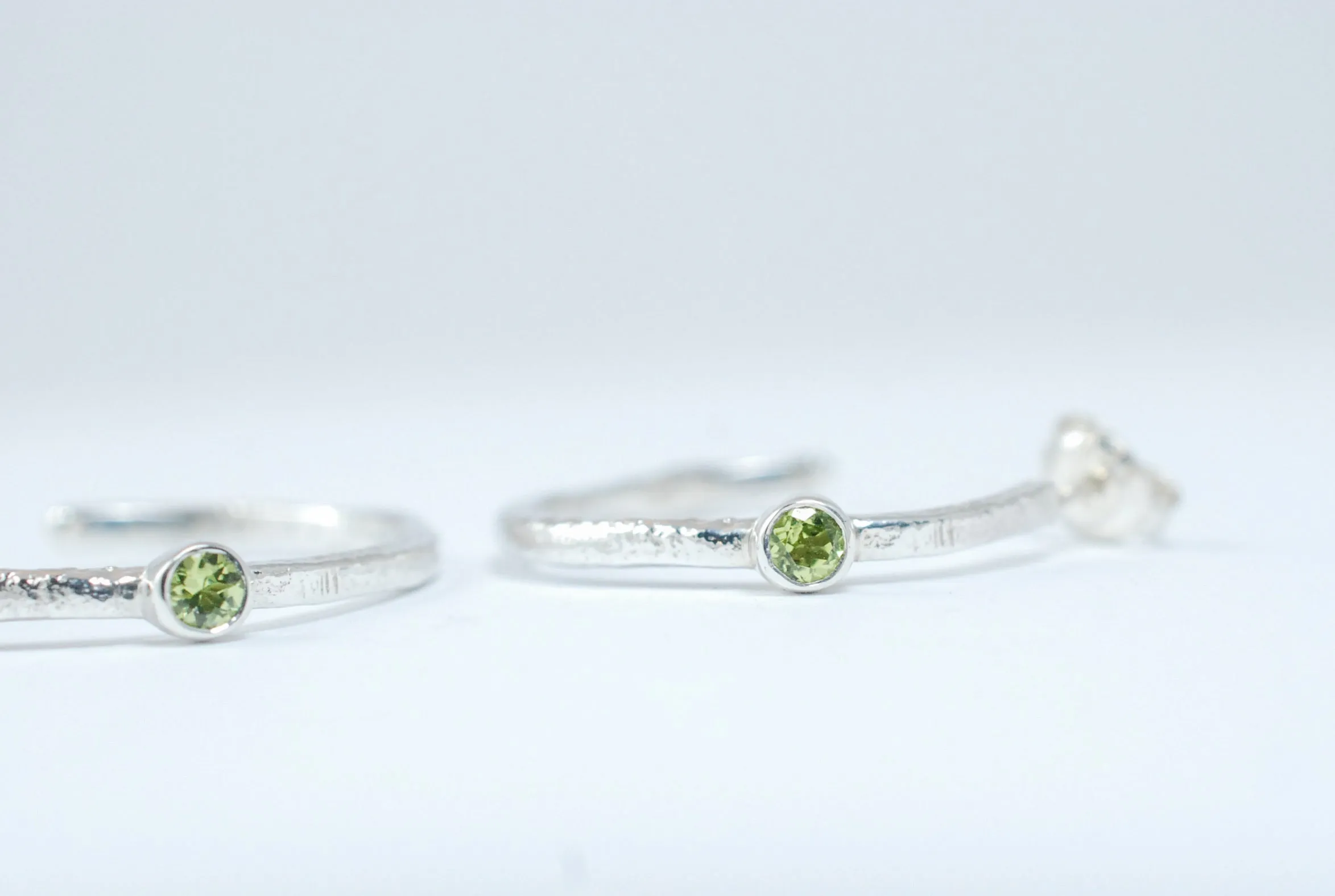 Silver hoops earrings with green peridot stone
