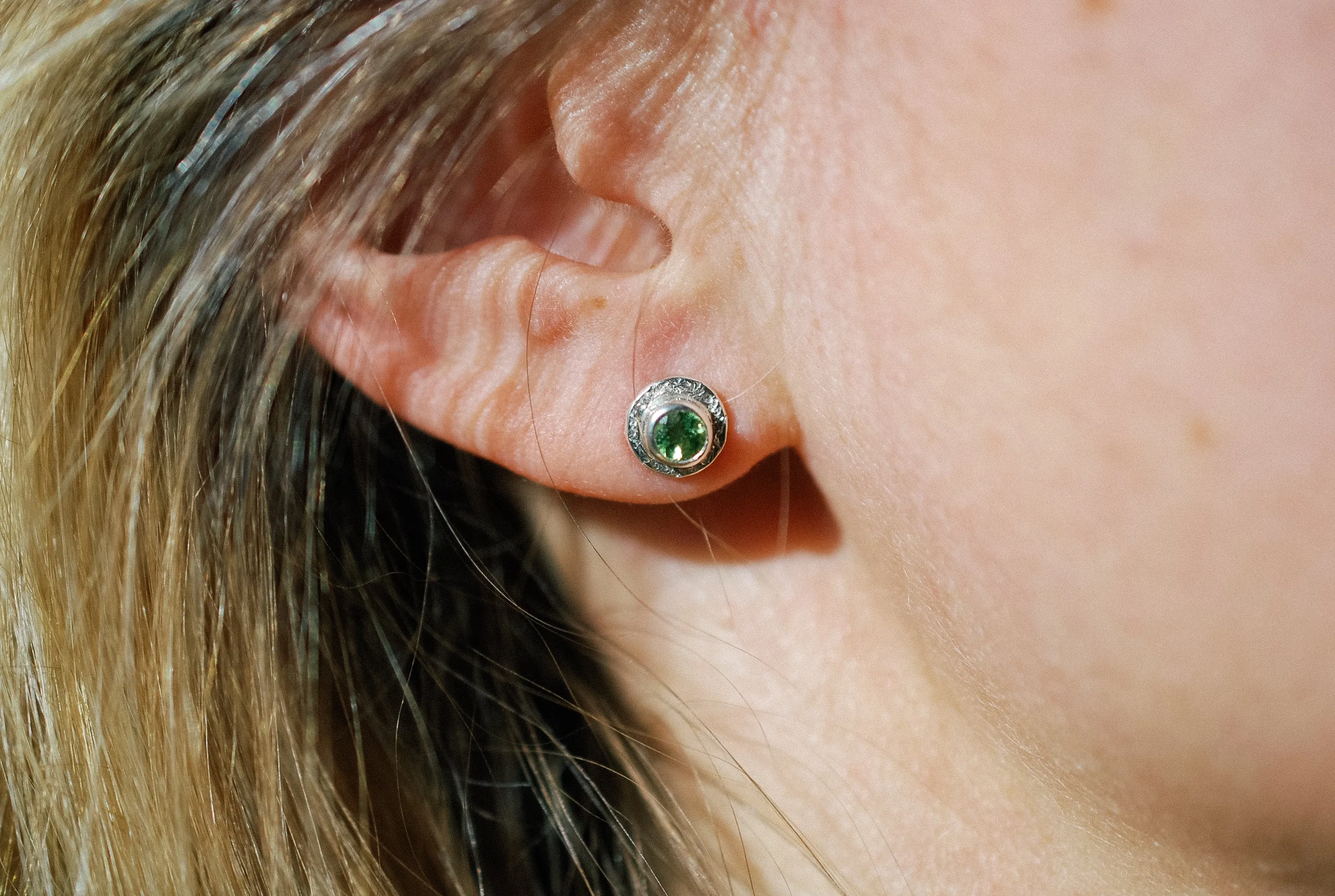 Silver stud earrings with green Peridot gemstone